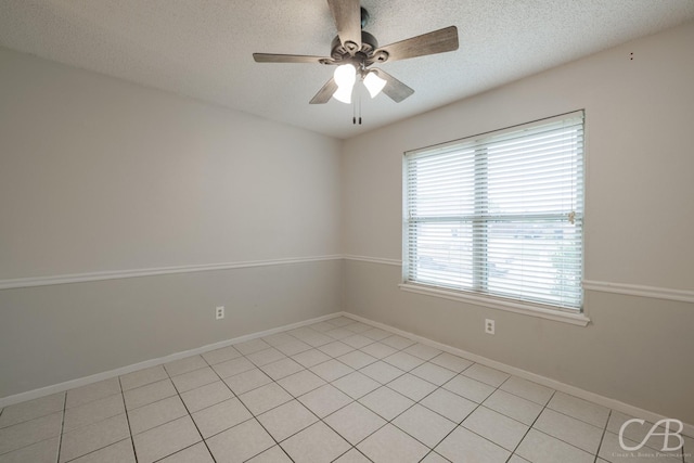 4417 Pamela Dr, Abilene, TX 79606 - empty room featuring a textured ceiling, a ceiling fan, and baseboards