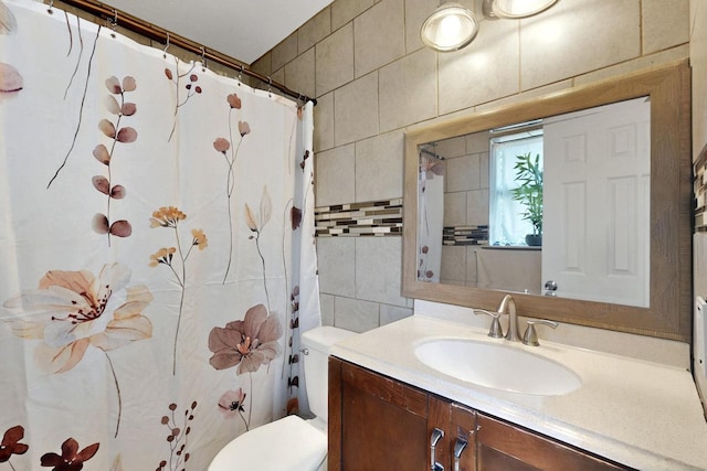 805 Loganwood Dr, Royse City, TX 75189 - bathroom with tile walls, toilet, vanity, and curtained shower