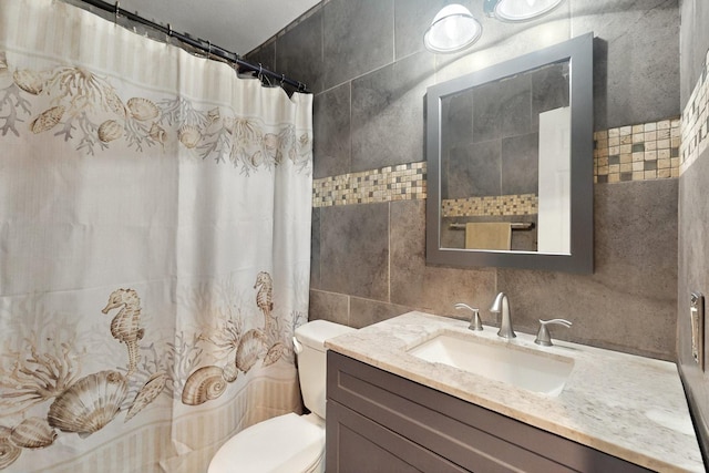 805 Loganwood Dr, Royse City, TX 75189 - bathroom featuring tile walls, toilet, vanity, and curtained shower