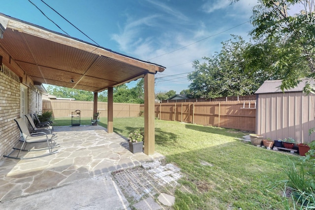 805 Loganwood Dr, Royse City, TX 75189 - view of yard featuring a storage unit, an outdoor structure, and a patio