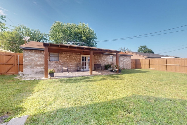 805 Loganwood Dr, Royse City, TX 75189 - back of house with brick siding and a patio area