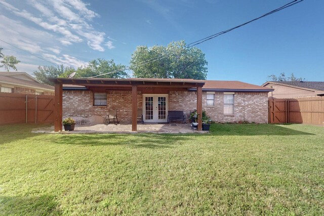 805 Loganwood Dr, Royse City, TX 75189 - back of property featuring french doors, brick siding, and a patio