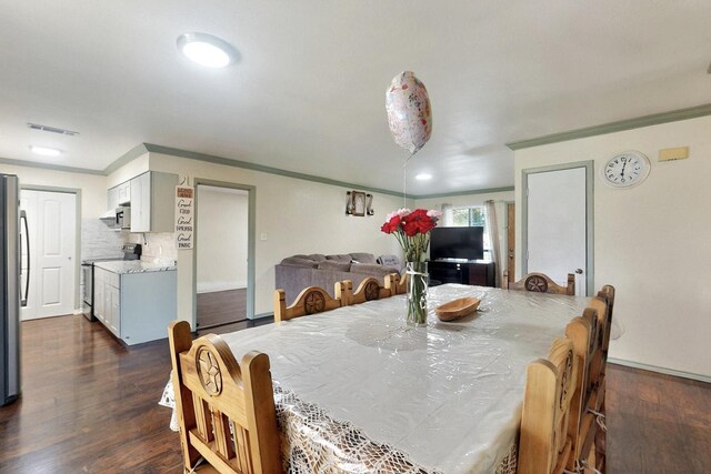 805 Loganwood Dr, Royse City, TX 75189 - dining room featuring crown molding and dark wood-style floors