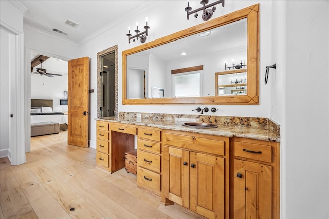 933 Glenhurst Rd, Keller, TX 76248 - bathroom featuring ornamental molding, wood finished floors, ensuite bathroom, ceiling fan, and vanity