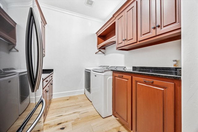 933 Glenhurst Rd, Keller, TX 76248 - kitchen featuring washing machine and dryer, freestanding refrigerator, crown molding, open shelves, and light wood-type flooring