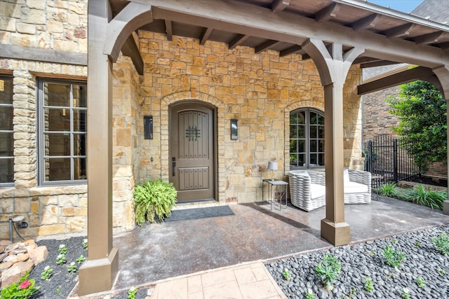 933 Glenhurst Rd, Keller, TX 76248 - view of exterior entry with stone siding, fence, and a patio