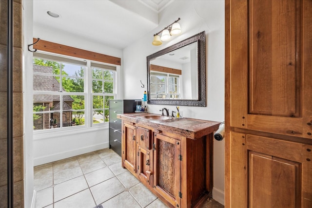 933 Glenhurst Rd, Keller, TX 76248 - bathroom with tile patterned floors, vanity, baseboards, and ornamental molding