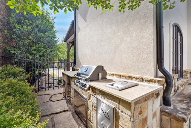 933 Glenhurst Rd, Keller, TX 76248 - view of patio / terrace with fence, grilling area, exterior kitchen, and a gate
