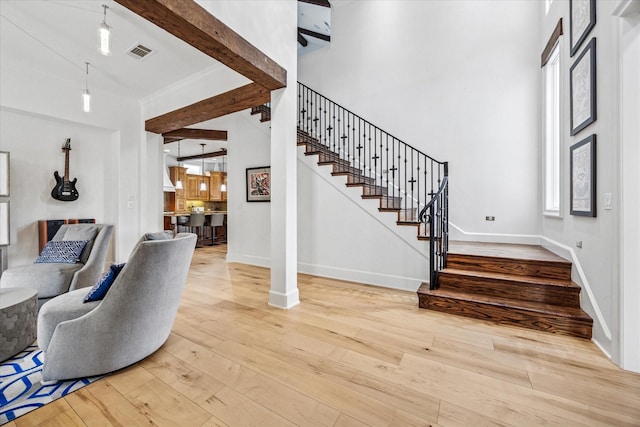 933 Glenhurst Rd, Keller, TX 76248 - foyer featuring stairs, a towering ceiling, hardwood / wood-style floors, and baseboards