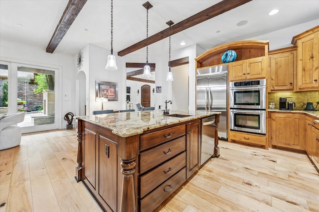 933 Glenhurst Rd, Keller, TX 76248 - kitchen with appliances with stainless steel finishes, a sink, beamed ceiling, light wood finished floors, and arched walkways