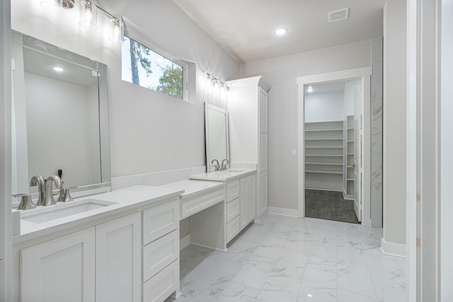 3928 Hogan Dr, Tyler, TX 75709 - full bath featuring vanity, baseboards, recessed lighting, marble finish flooring, and a spacious closet