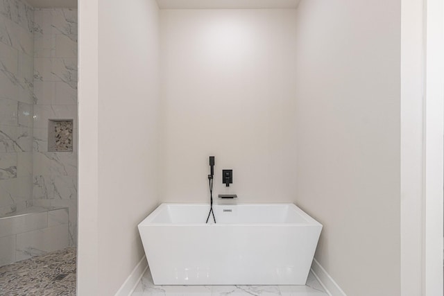 3928 Hogan Dr, Tyler, TX 75709 - full bathroom featuring marble look tile flooring, baseboards, and a soaking tub