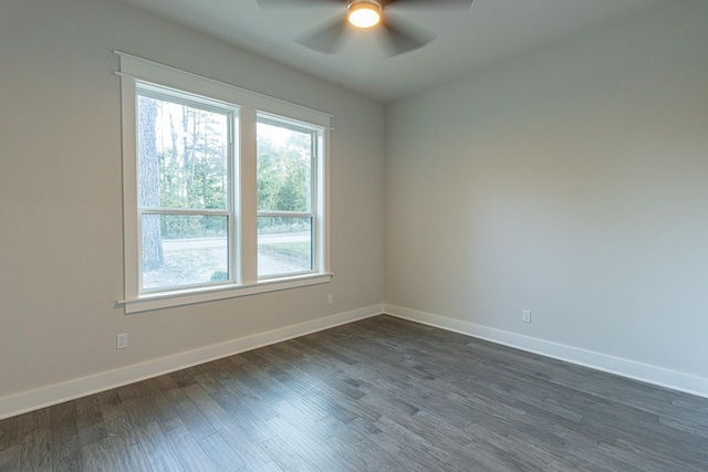 3928 Hogan Dr, Tyler, TX 75709 - empty room with a ceiling fan, baseboards, and dark wood-type flooring