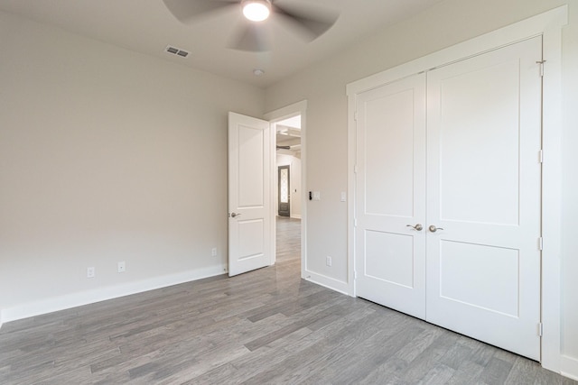 3928 Hogan Dr, Tyler, TX 75709 - unfurnished bedroom with light wood-type flooring, a closet, baseboards, and a ceiling fan