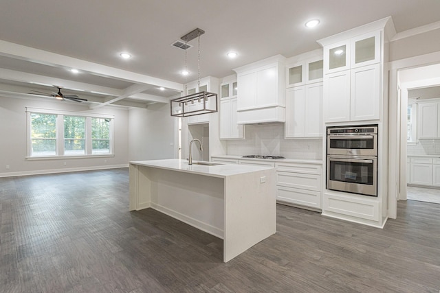 3928 Hogan Dr, Tyler, TX 75709 - kitchen with a sink, stainless steel double oven, backsplash, dark wood finished floors, and recessed lighting