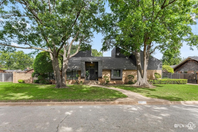 4403 Nassau Dr, Wichita Falls, TX 76308 - mid-century modern home with brick siding and roof with shingles