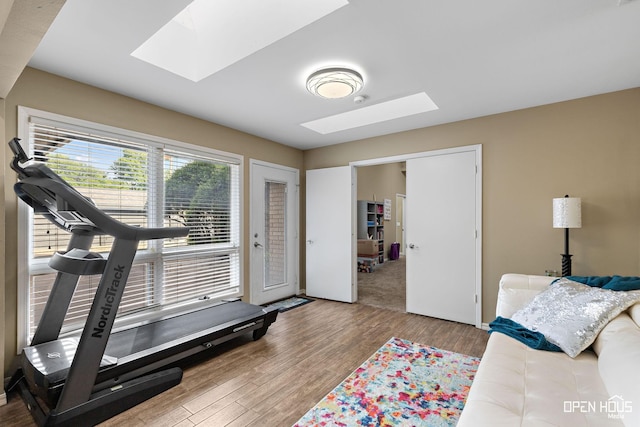 4403 Nassau Dr, Wichita Falls, TX 76308 - workout room featuring a skylight and wood finished floors