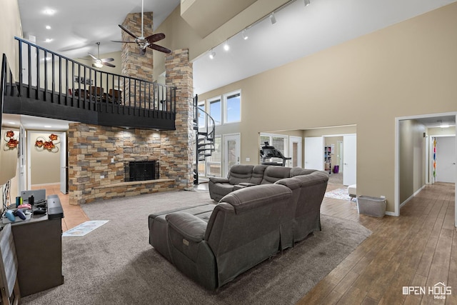 4403 Nassau Dr, Wichita Falls, TX 76308 - living area featuring high vaulted ceiling, a fireplace, stairs, ceiling fan, and rail lighting