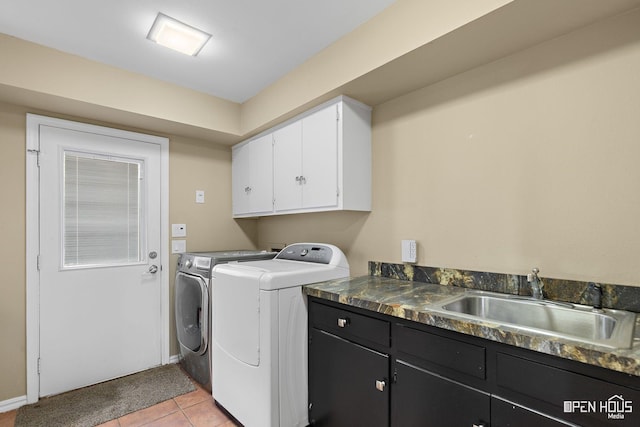 4403 Nassau Dr, Wichita Falls, TX 76308 - laundry area with cabinet space, independent washer and dryer, baseboards, and light tile patterned flooring