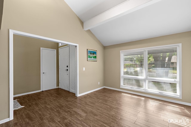 4403 Nassau Dr, Wichita Falls, TX 76308 - unfurnished room featuring beam ceiling, wood finished floors, baseboards, and high vaulted ceiling