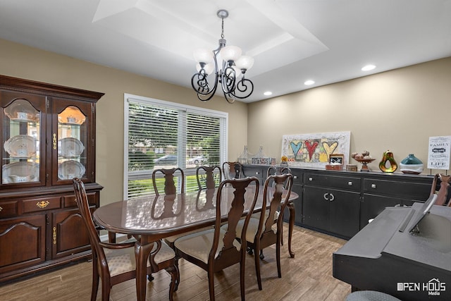 4403 Nassau Dr, Wichita Falls, TX 76308 - dining room featuring a chandelier, light wood-style floors, a tray ceiling, and recessed lighting