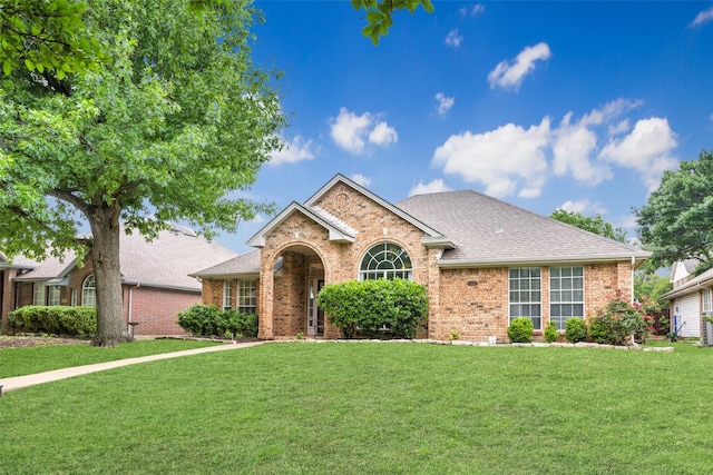 8630 Hidden Spring Dr, Frisco, TX 75034 - traditional home featuring brick siding, a front lawn, and a shingled roof