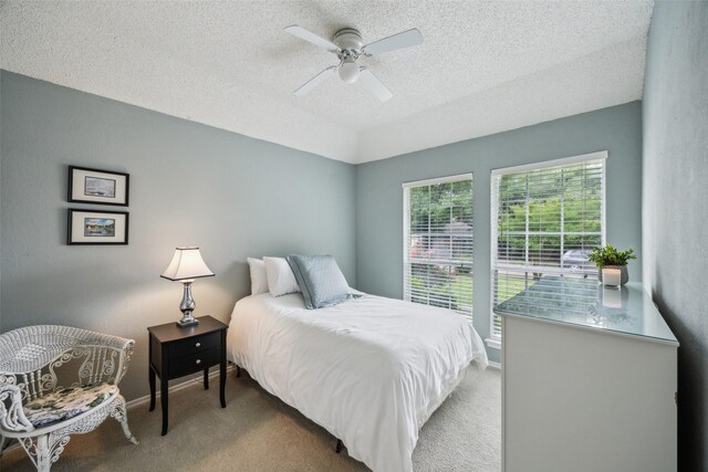 8630 Hidden Spring Dr, Frisco, TX 75034 - bedroom featuring carpet floors, a textured ceiling, ceiling fan, vaulted ceiling, and baseboards