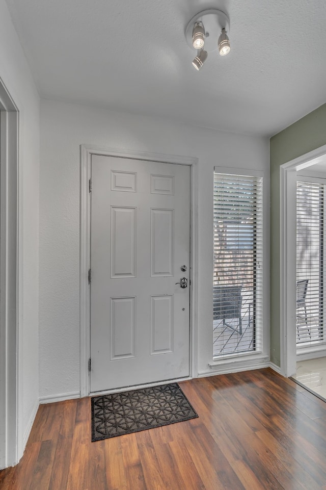6433 Southpoint Dr, Dallas, TX 75248 - foyer entrance featuring baseboards and wood finished floors