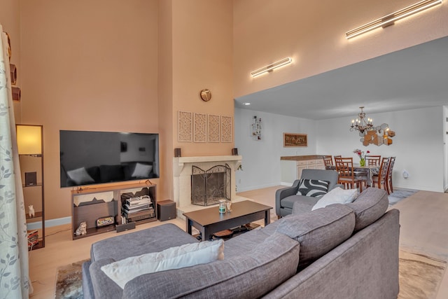 6433 Southpoint Dr, Dallas, TX 75248 - living room with a chandelier, a towering ceiling, baseboards, and a fireplace