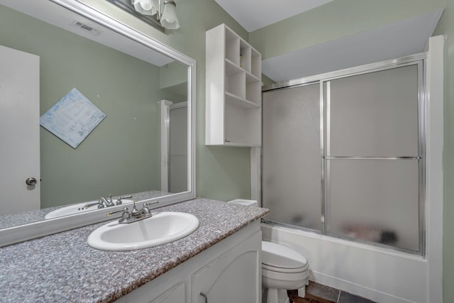6433 Southpoint Dr, Dallas, TX 75248 - bathroom with toilet, shower / bath combination with glass door, and vanity