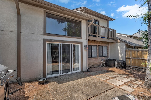 6433 Southpoint Dr, Dallas, TX 75248 - rear view of property with a balcony, stucco siding, and fence