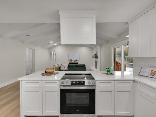 8521 Brookridge Dr, North Richland Hills, TX 76182 - kitchen featuring electric stove, a peninsula, white cabinets, light countertops, and light wood-type flooring