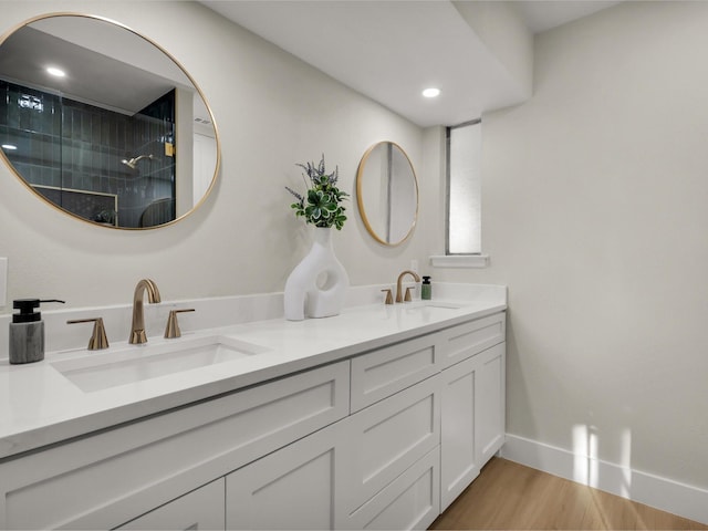 8521 Brookridge Dr, North Richland Hills, TX 76182 - full bath featuring double vanity, wood finished floors, a tile shower, and recessed lighting