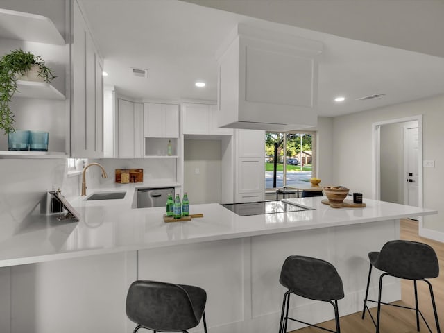 8521 Brookridge Dr, North Richland Hills, TX 76182 - kitchen featuring open shelves, stainless steel dishwasher, black electric cooktop, a peninsula, and recessed lighting