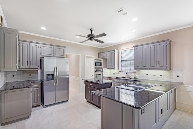 3213 Louis Dr, Plano, TX 75023 - kitchen with appliances with stainless steel finishes, gray cabinetry, ceiling fan, a center island, and a peninsula