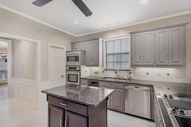 3213 Louis Dr, Plano, TX 75023 - kitchen featuring appliances with stainless steel finishes, a sink, gray cabinets, a ceiling fan, and dark stone counters