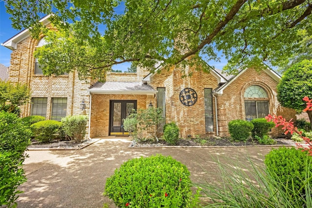 3213 Louis Dr, Plano, TX 75023 - view of front of house featuring brick siding and french doors