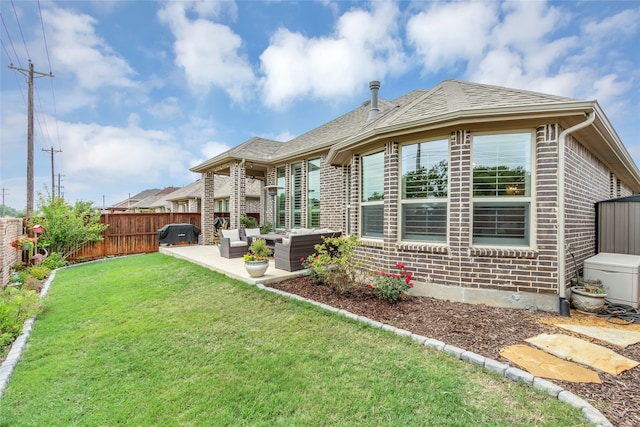 9012 Terrel St, Lantana, TX 76226 - rear view of house featuring an outdoor hangout area, brick siding, and a patio