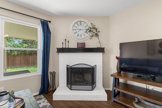 8308 Montecito Dr, Denton, TX 76210 - living room with a fireplace, baseboards, and wood finished floors