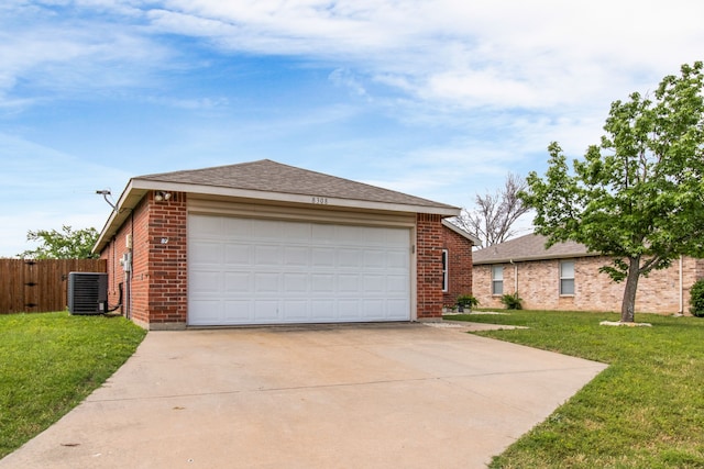 8308 Montecito Dr, Denton, TX 76210 - view of front of house featuring central AC, brick siding, and driveway
