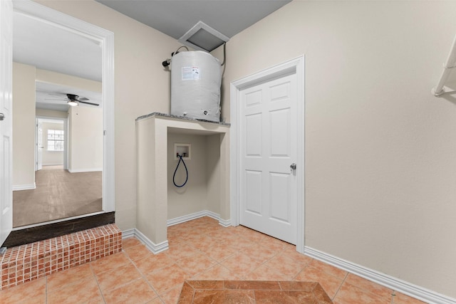 1008 Pleasant Dr, Dallas, TX 75217 - clothes washing area with hookup for a washing machine, light tile patterned floors, a ceiling fan, baseboards, and water heater