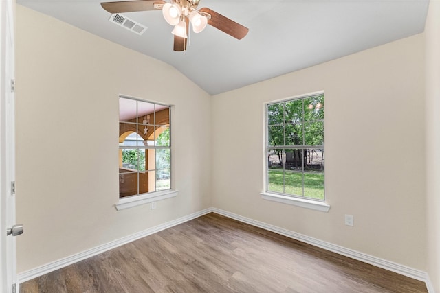 1008 Pleasant Dr, Dallas, TX 75217 - empty room featuring wood finished floors, lofted ceiling, ceiling fan, and baseboards