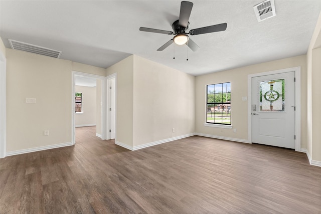 1008 Pleasant Dr, Dallas, TX 75217 - unfurnished living room with wood finished floors, a ceiling fan, and baseboards