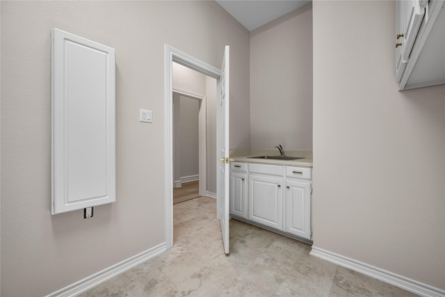 934 Hills Creek Dr, Mckinney, TX 75072 - hallway with a sink and baseboards