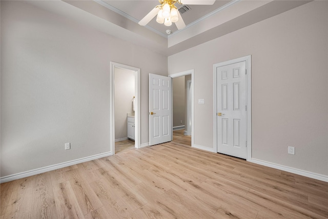 934 Hills Creek Dr, Mckinney, TX 75072 - unfurnished bedroom with crown molding, wood finished floors, baseboards, connected bathroom, and a tray ceiling
