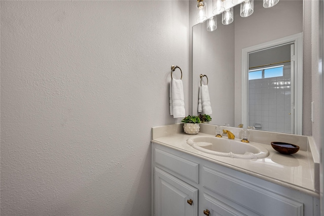934 Hills Creek Dr, Mckinney, TX 75072 - bathroom featuring vanity and a textured wall