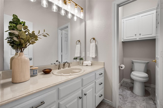 934 Hills Creek Dr, Mckinney, TX 75072 - bathroom featuring marble finish flooring, vanity, toilet, and baseboards