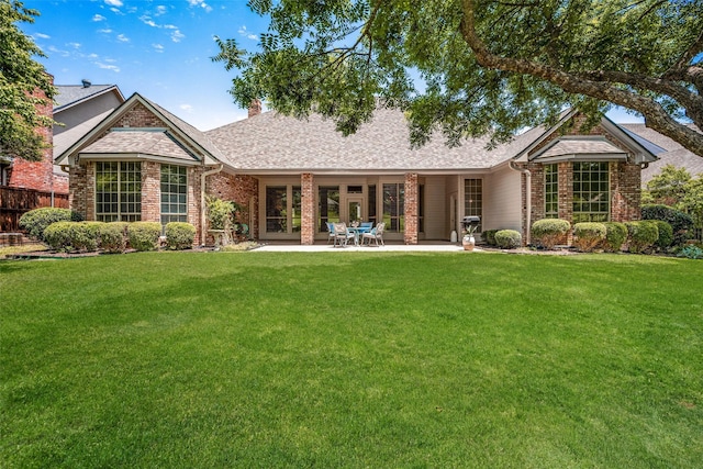 934 Hills Creek Dr, Mckinney, TX 75072 - rear view of property with brick siding, roof with shingles, a chimney, and a patio area