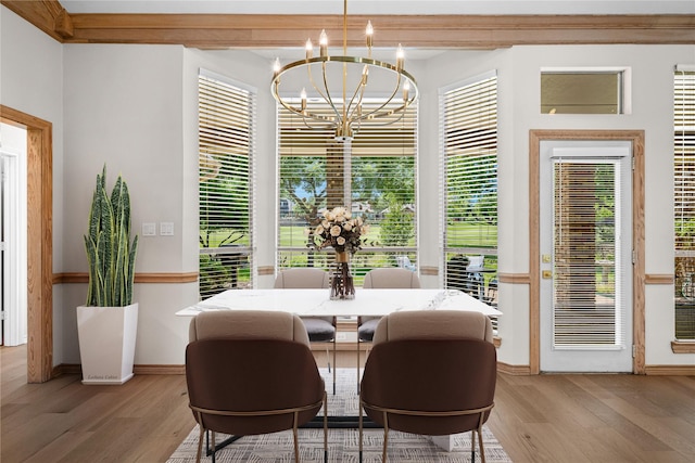 934 Hills Creek Dr, Mckinney, TX 75072 - dining room with light wood-style flooring, a chandelier, and baseboards