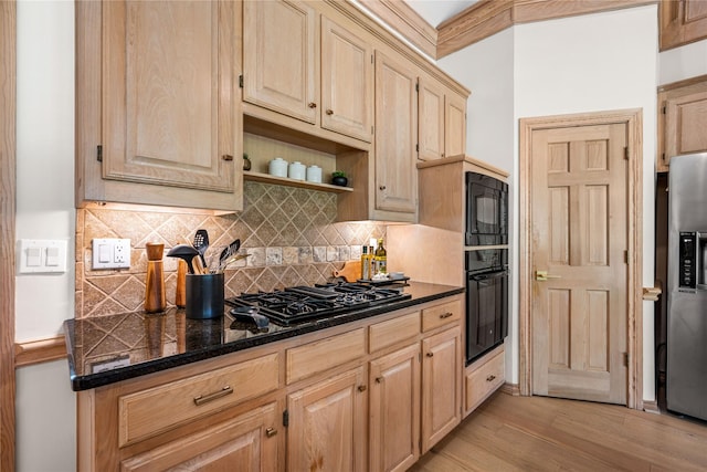 934 Hills Creek Dr, Mckinney, TX 75072 - kitchen featuring black appliances, light brown cabinetry, light wood-style floors, and decorative backsplash